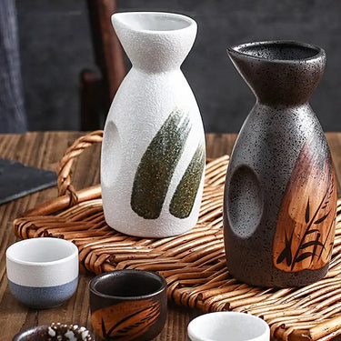 Vintage Ceramic Japanese Sake Set with White and Green Design, Traditional Sake Bottles and Cups on a Wooden Table