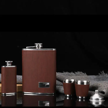 Elegant stainless steel hip flask set with matching cups on a dark background, perfect for enjoying beverages on the go.