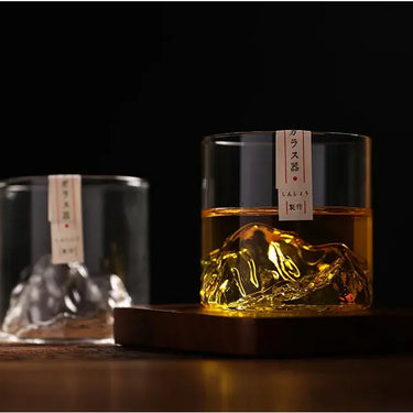 3D Mountain Whisky Glass with whisky, showcasing intricate mountain design, elevating the whisky experience against a dark elegant background.