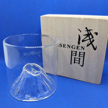 EDO Fuji whisky glass with Mount Fuji design and wooden box in the background.