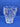 Modern Mout Yong whisky glass with artistic design on blue background.