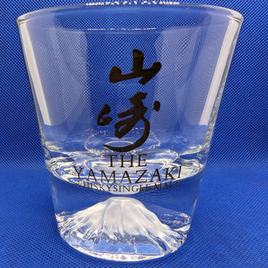 Yamazaki Gold whisky tumbler with Mount Fuji design on a blue background