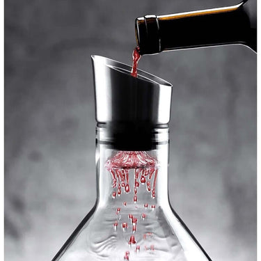 Pouring red wine into a European Iceberg lead-free crystal glass decanter with an elegant design.