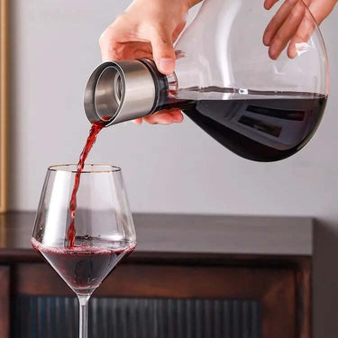 Lead-free crystal decanter pouring red wine into a glass, showcasing elegant barware and wine serving.