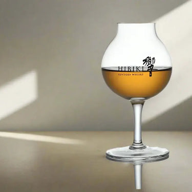 Hibiki Professional Blender Whisky Glass on a table with shadows in the background