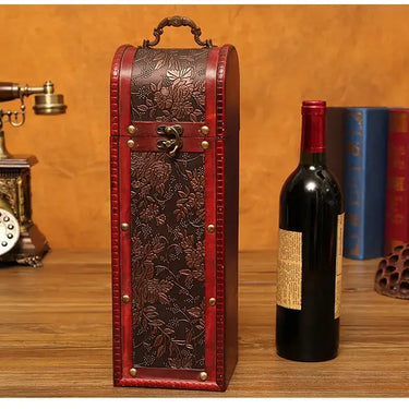 Vintage Red Wine Single Wooden Wine Box with decorative floral pattern beside a bottle of red wine on a wooden table