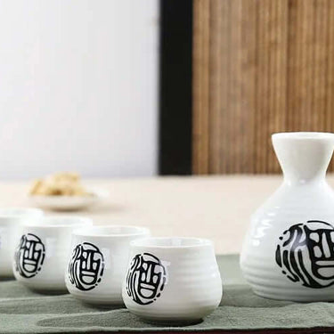 Traditional Japanese Tokkuri Bottle and Ochoko Cups Sake Set with Artistic Design, 5 Pcs for Sake Enthusiasts