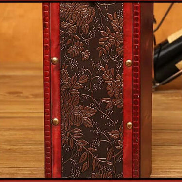 Vintage red wine single wooden wine box with intricate floral carvings and red accents.