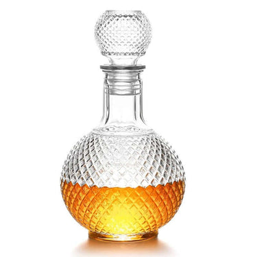 Elegant glass whiskey decanter with textured globe design and airtight stopper, showcasing amber whiskey.