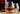 Drifting Snow Whisky Tasting Glasses showcasing Japanese Hammer Pattern and spiral design with whiskey on a wooden coaster.