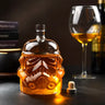 Trooper Glass Whisky Decanter featuring a Stormtrooper design and amber whisky, complemented by a wine glass in the background.