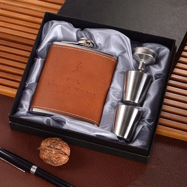 Premium stainless steel hip flask set in a gift box with leather wrap and two shot glasses, perfect for on-the-go whisky lovers.